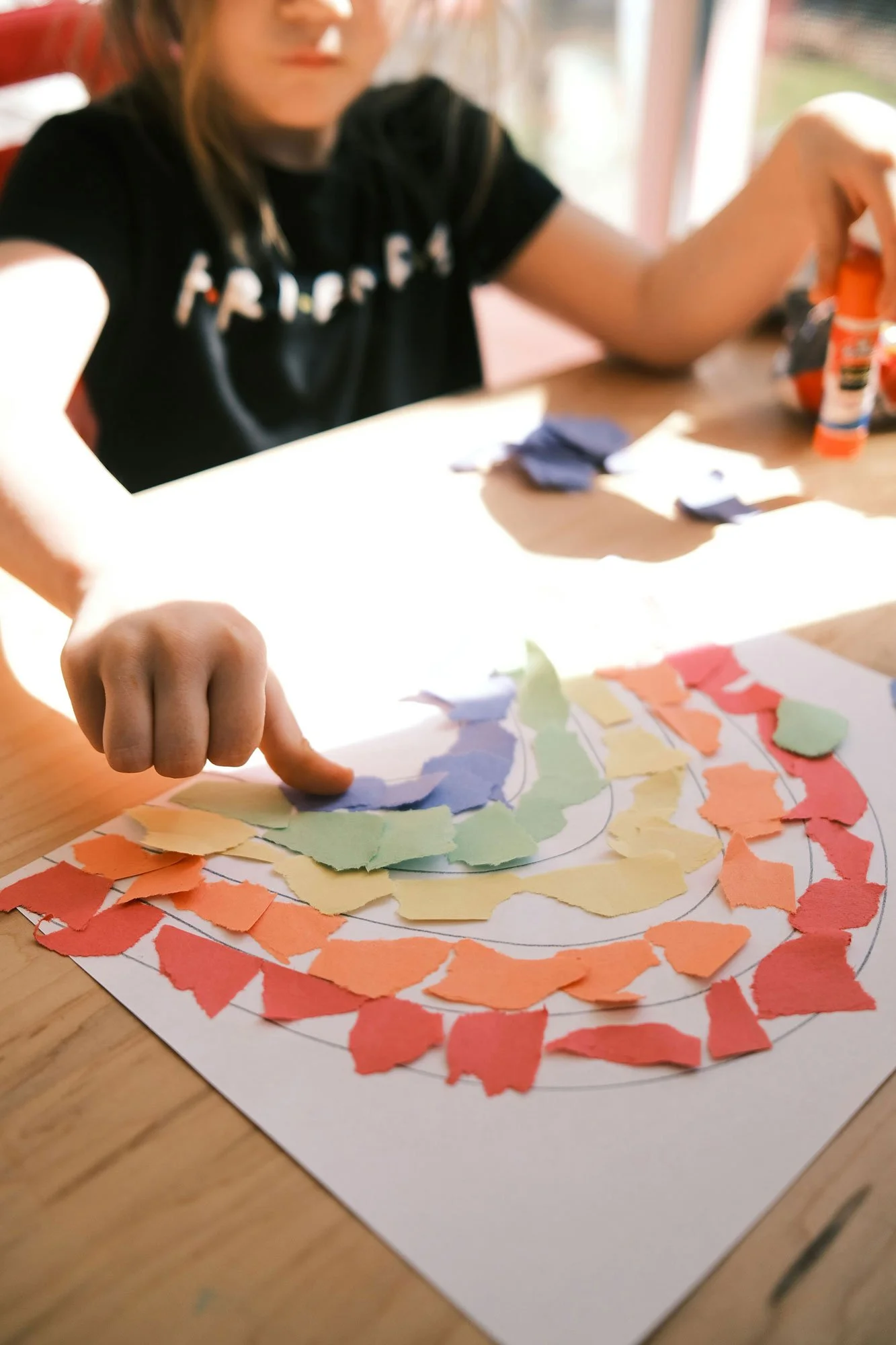 Colourful torn-paper craft spiral